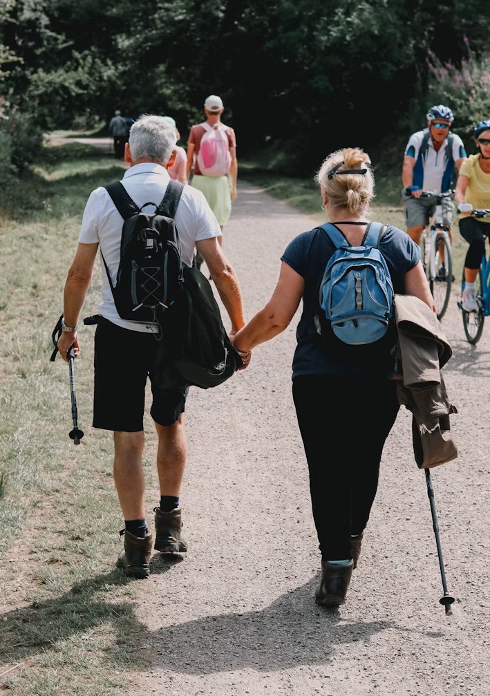 a senior couple on a walk holding hands