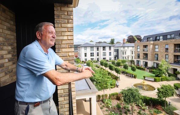 Platinum Skies Chapters homeowner looking over communal gardens